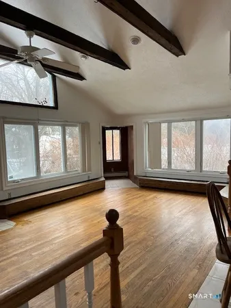 a view of livingroom with furniture and windows