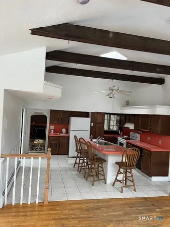 a view of living room with furniture and fireplace