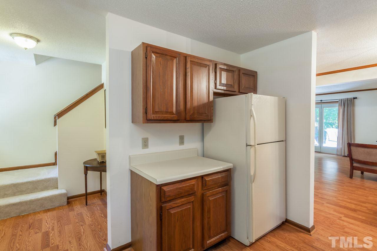 6679 English Ivy Lane Raleigh, NC 27615 - Photo 2 of 24 a utility room with cabinets washer and dryer