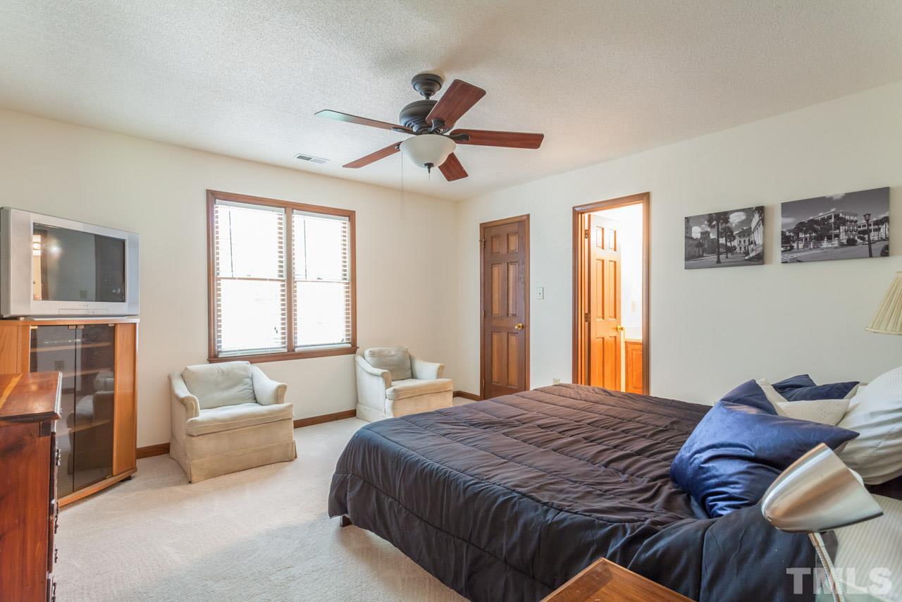 6679 English Ivy Lane Raleigh, NC 27615 - Photo 12 of 24 a bedroom with a bed and window