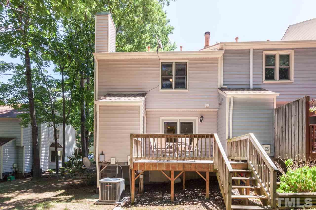 6679 English Ivy Lane Raleigh, NC 27615 - Photo 19 of 24 a front view of a house with a garden