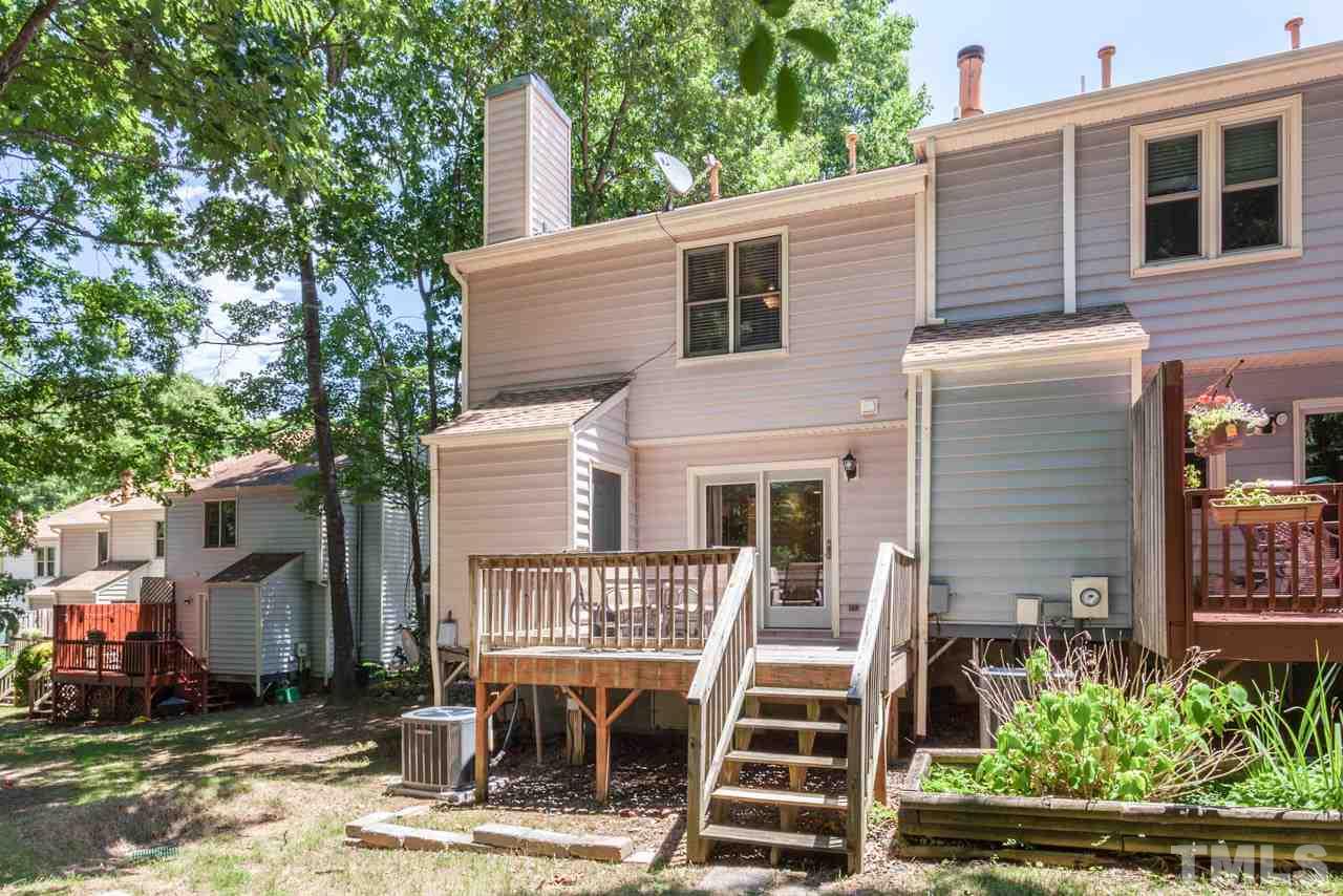 6679 English Ivy Lane Raleigh, NC 27615 - Photo 21 of 24 a front view of a house with a yard