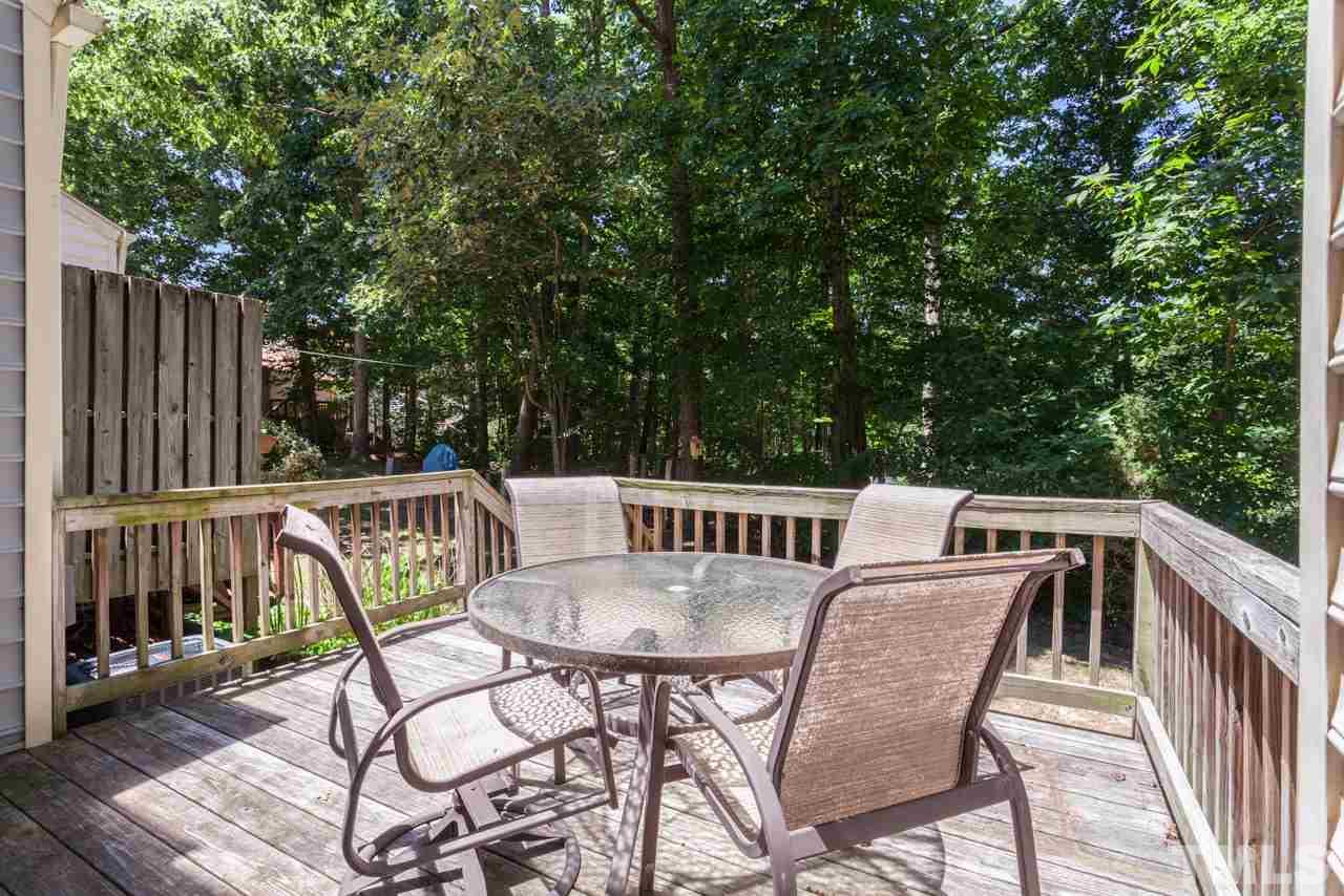 6679 English Ivy Lane Raleigh, NC 27615 - Photo 23 of 24 a view of a chairs and table in the deck