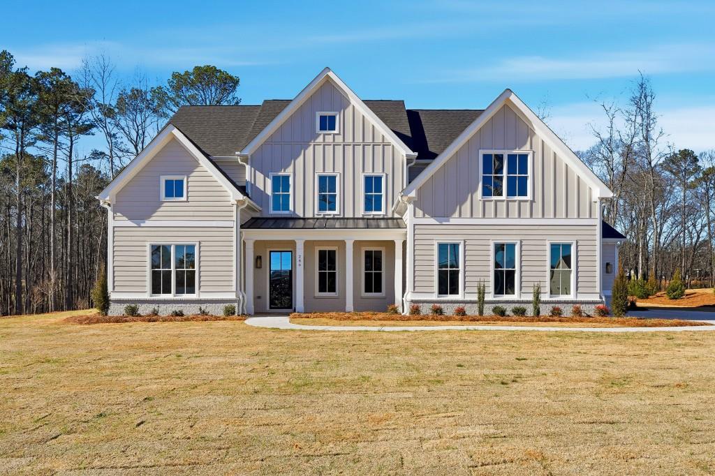 a front view of a house with a yard