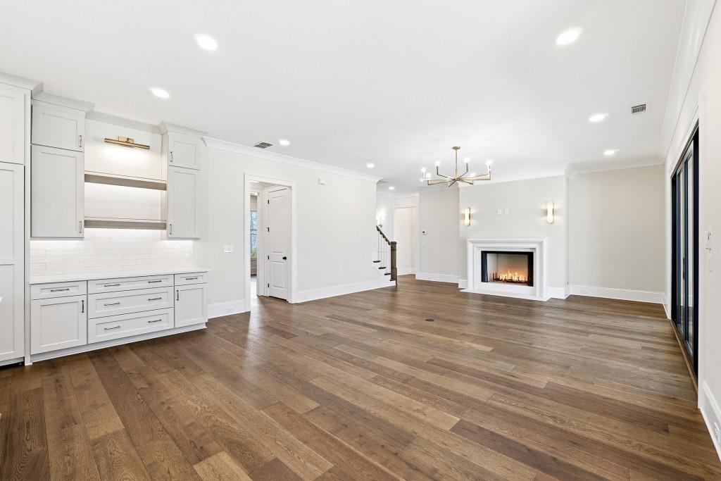 286 County Road Southwest Marietta, GA 30064 - Photo 11 of 40 an empty room with kitchen and fireplace