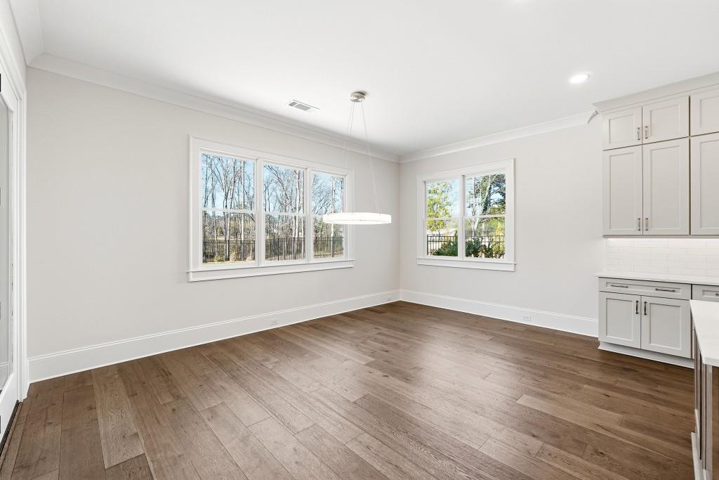 286 County Road Southwest Marietta, GA 30064 - Photo 17 of 40 an empty room with wooden floor and windows