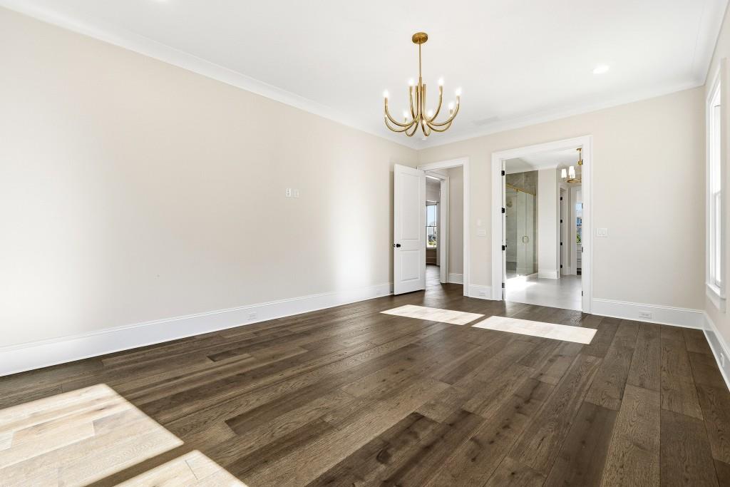 286 County Road Southwest Marietta, GA 30064 - Photo 21 of 40 a view of a room with wooden floor and chandelier