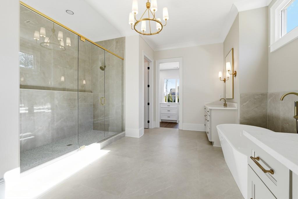 286 County Road Southwest Marietta, GA 30064 - Photo 24 of 40 a bathroom with a sink a mirror and a shower