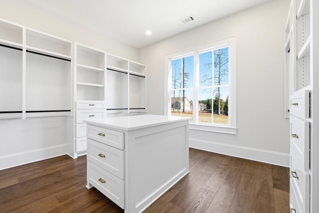 286 County Road Southwest Marietta, GA 30064 - Photo 26 of 40 a bathroom with a double vanity sink a mirror and a bathtub