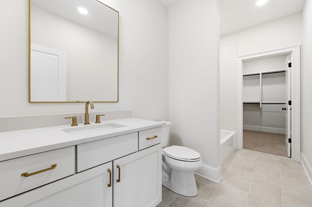 286 County Road Southwest Marietta, GA 30064 - Photo 28 of 40 a bathroom with a toilet sink and a mirror