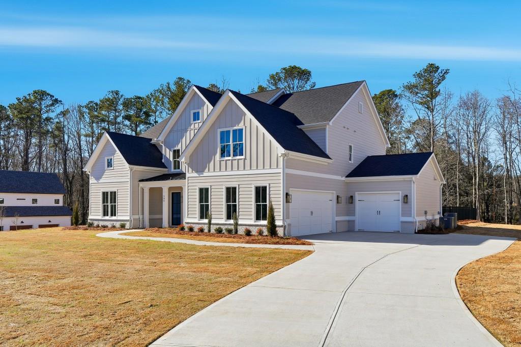 286 County Road Southwest Marietta, GA 30064 - Photo 3 of 40 a front view of a house with a yard