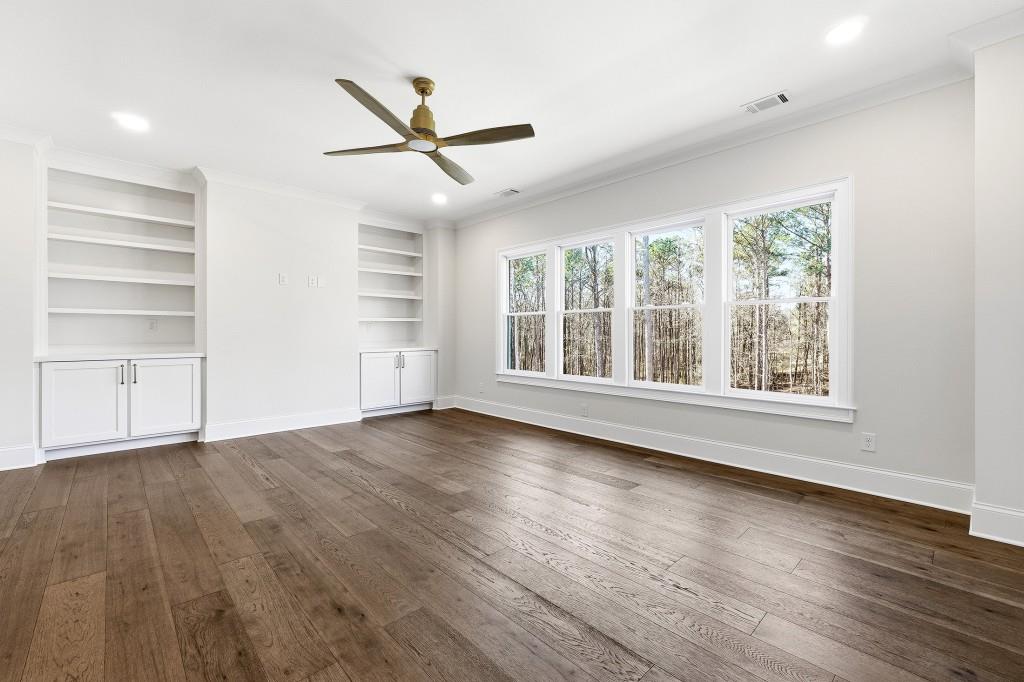 286 County Road Southwest Marietta, GA 30064 - Photo 31 of 40 an empty room with wooden floor fan and windows