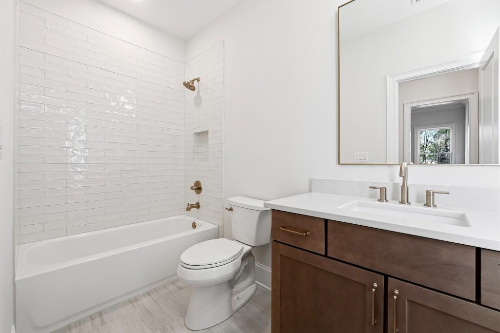 286 County Road Southwest Marietta, GA 30064 - Photo 35 of 40 a bathroom with a sink a toilet and shower