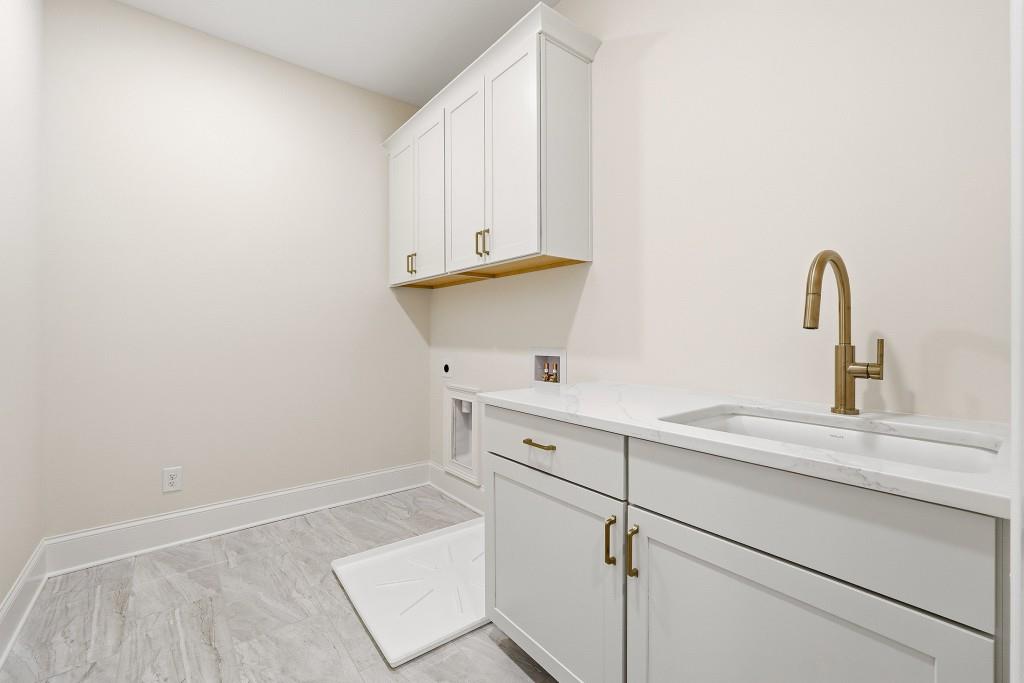 286 County Road Southwest Marietta, GA 30064 - Photo 37 of 40 a kitchen with a sink and cabinets