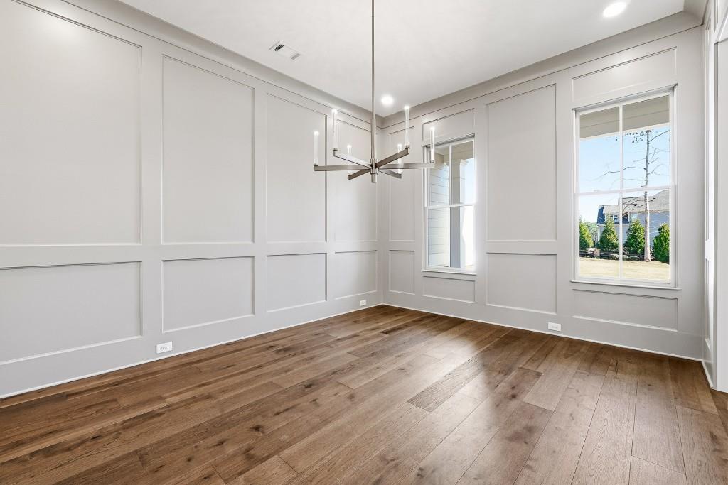 286 County Road Southwest Marietta, GA 30064 - Photo 7 of 40 an empty room with wooden floor closet and windows