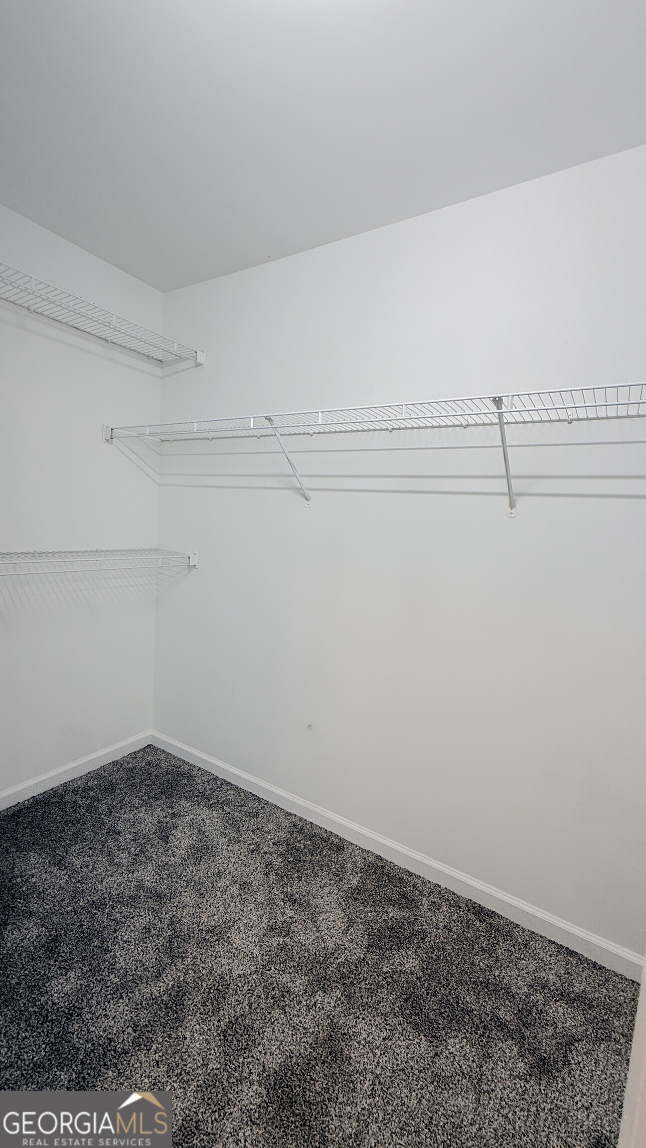 3395 Woodlake Lane Villa Rica, GA 30180 - Photo 16 of 25 a view of a room with racks on the wall