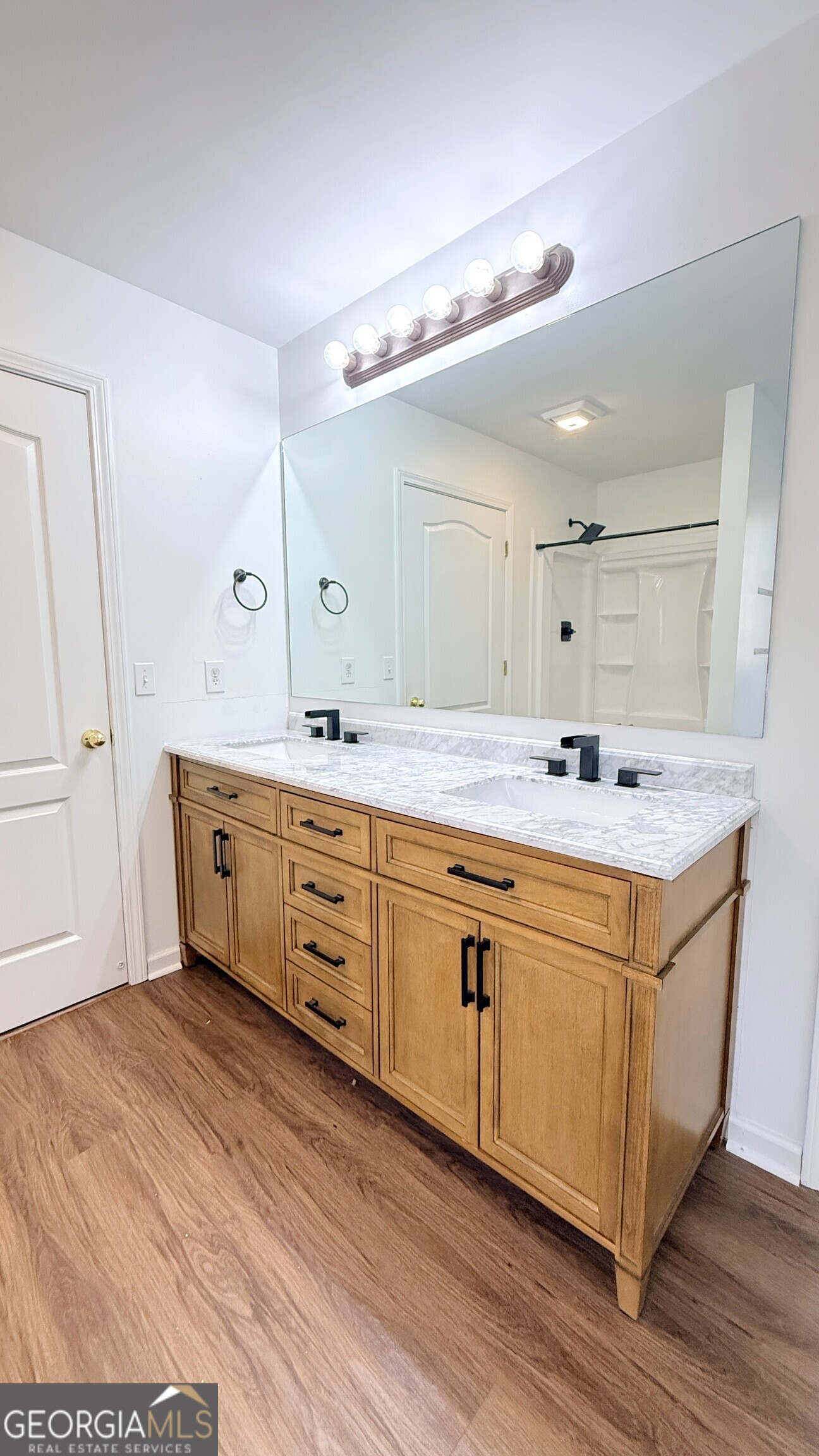 3395 Woodlake Lane Villa Rica, GA 30180 - Photo 17 of 25 a spacious bathroom with a double vanity sink mirror and