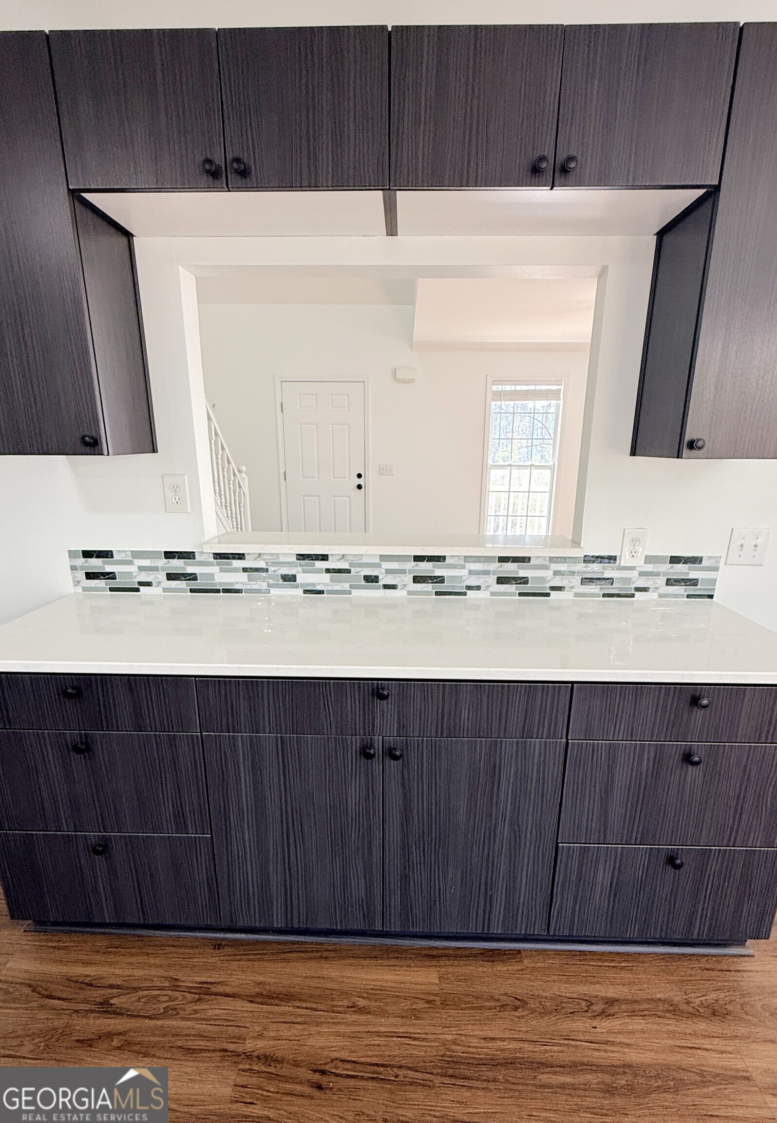 3395 Woodlake Lane Villa Rica, GA 30180 - Photo 8 of 25 a view of kitchen with white cabinets