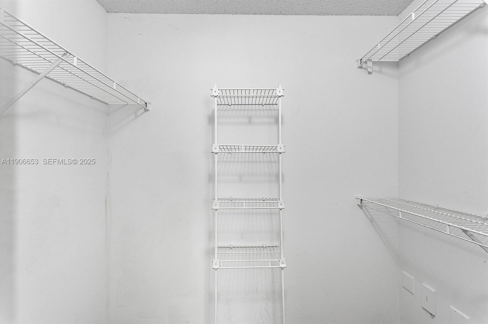 4852 Highway 7, Unit 303 Coconut Creek, FL 33073 - Photo 11 of 26 a view of walk in closet