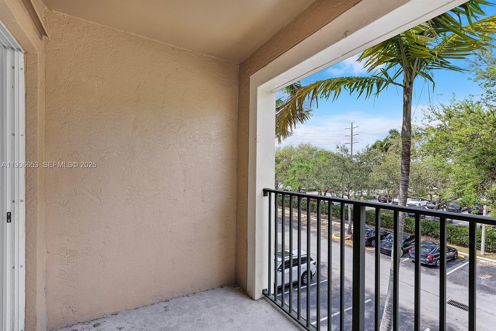 4852 Highway 7, Unit 303 Coconut Creek, FL 33073 - Photo 12 of 26 a view of a porch