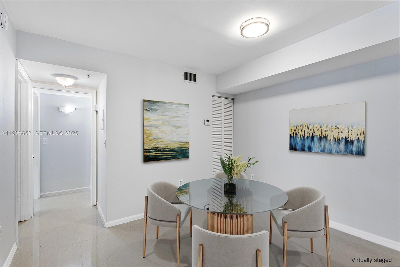 4852 Highway 7, Unit 303 Coconut Creek, FL 33073 - Photo 4 of 26 a view of a dining room with furniture