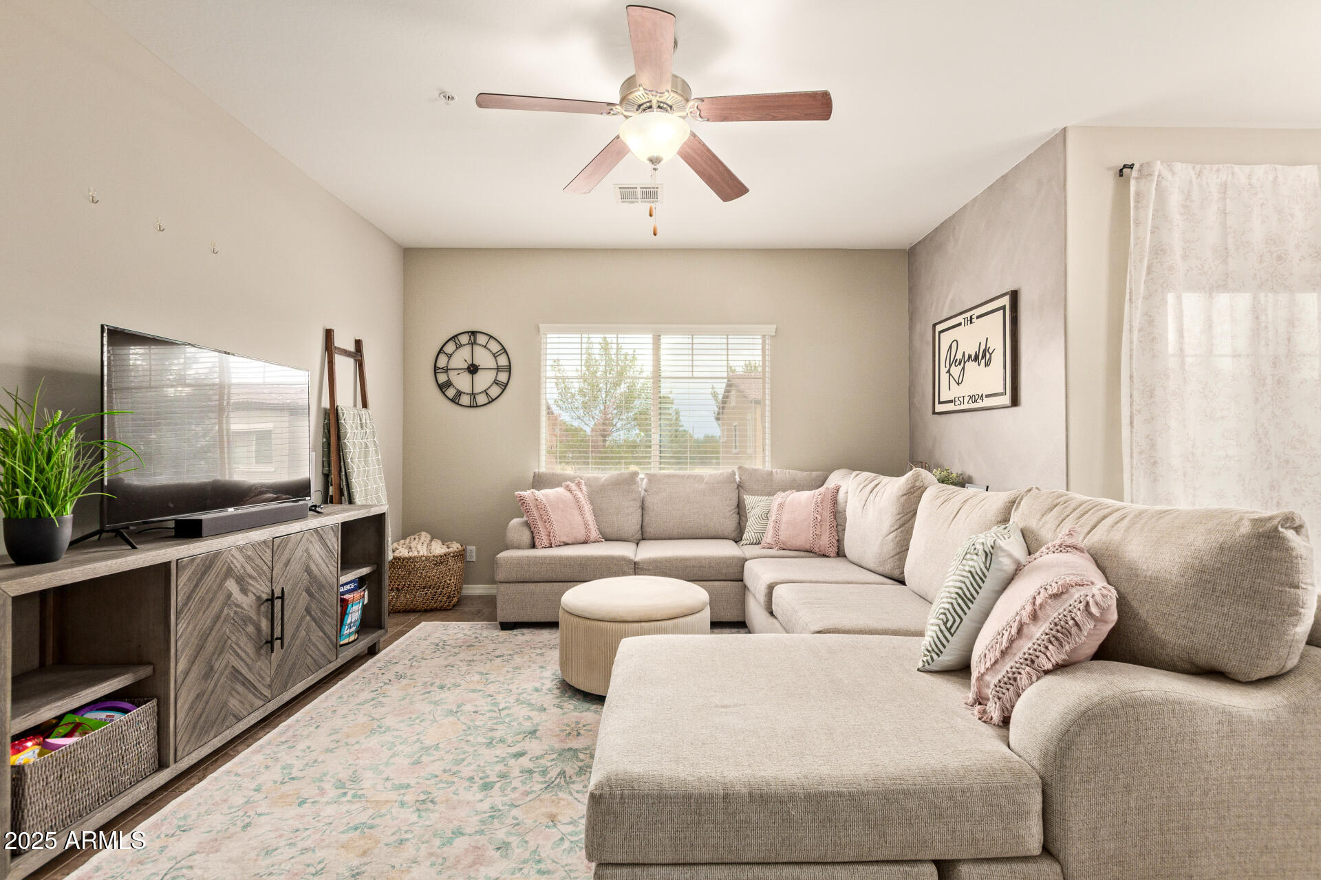 7726 East Baseline Road, Unit 234 Mesa, AZ 85209 - Photo 2 of 31 a living room with furniture and a flat screen tv