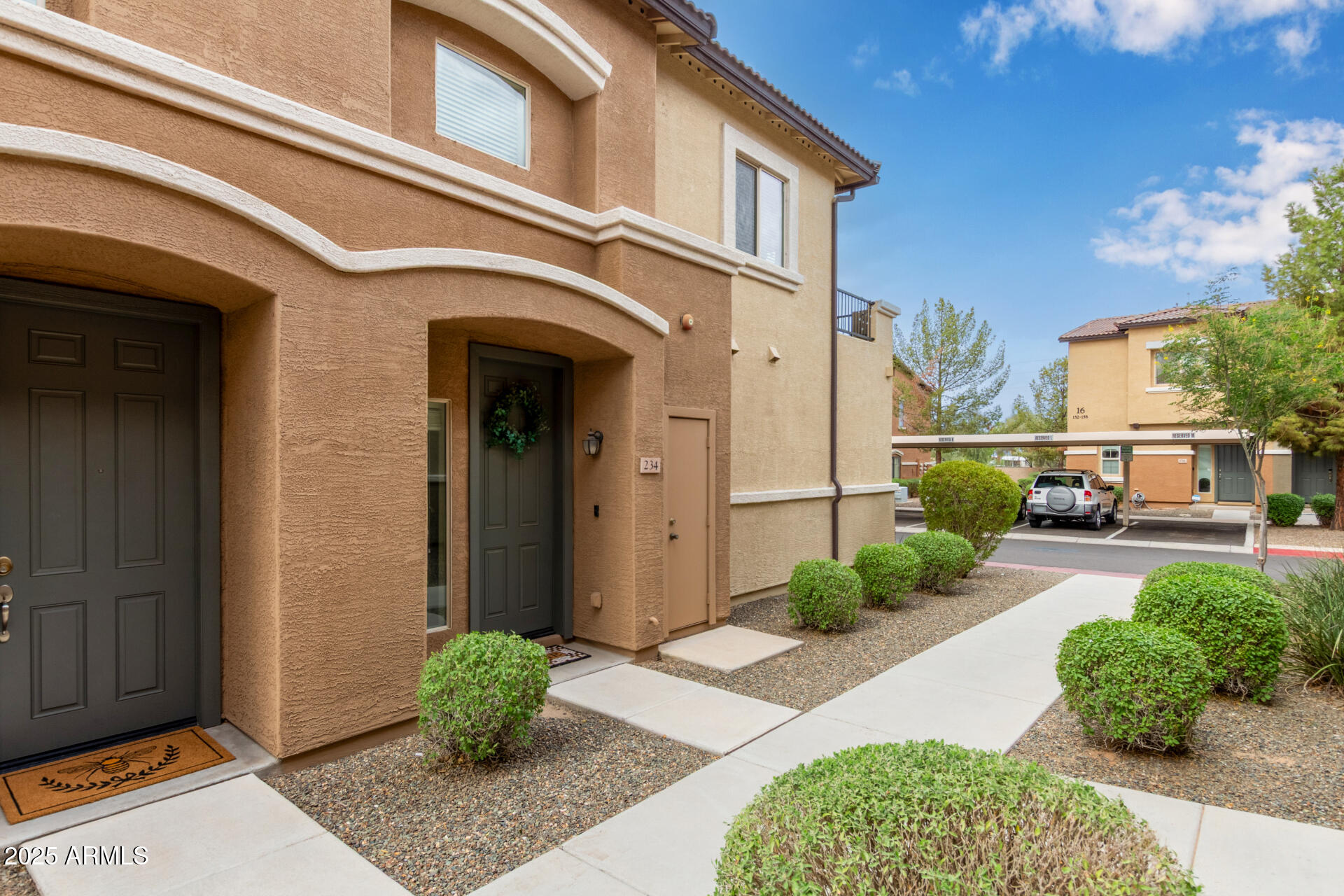 7726 East Baseline Road, Unit 234 Mesa, AZ 85209 - Photo 22 of 31 a front view of a house with garden