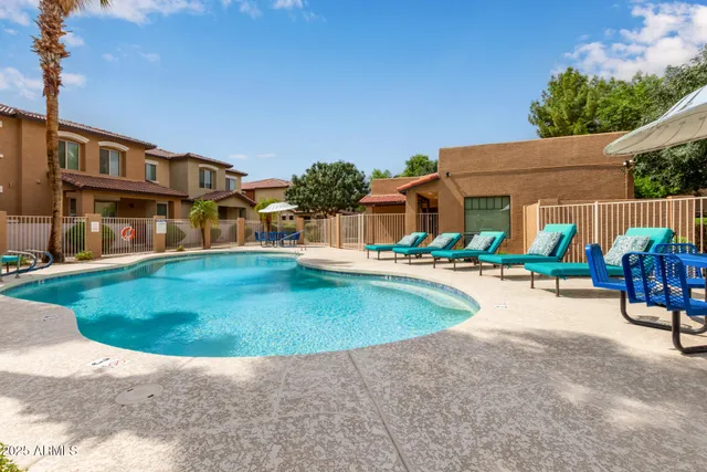a view of swimming pool with outdoor seating