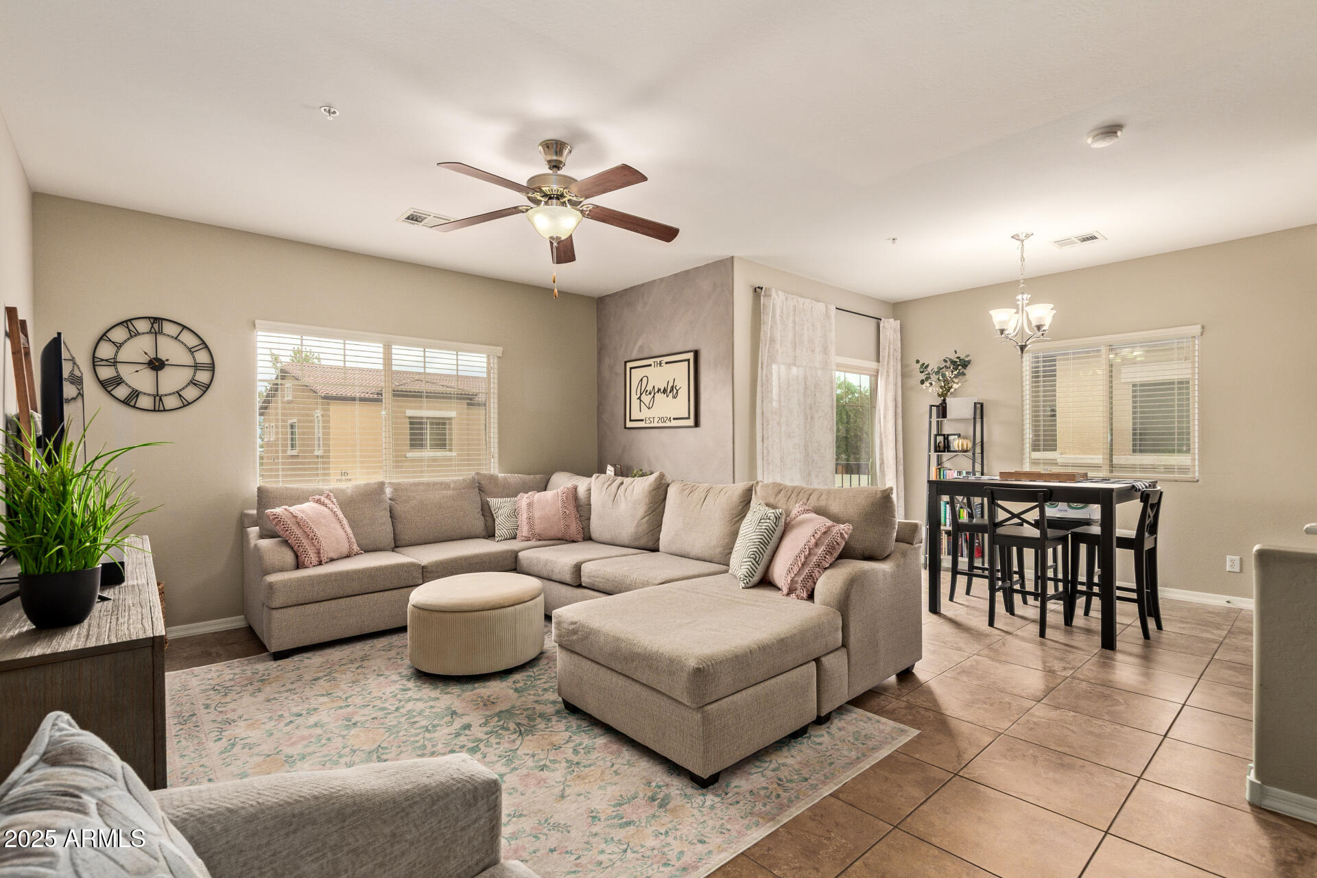 7726 East Baseline Road, Unit 234 Mesa, AZ 85209 - Photo 3 of 31 a living room with furniture and a large window