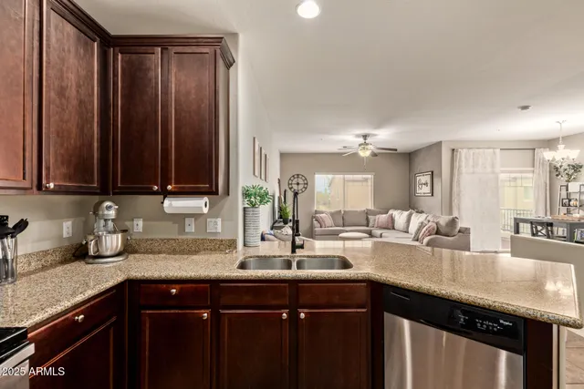 a kitchen with sink and cabinets