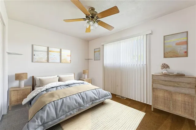 a bedroom with bed and window