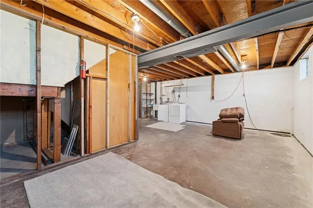 a backyard of a house with barbeque oven and seating space