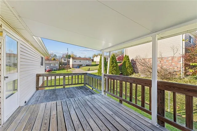 a view of two chairs in a balcony