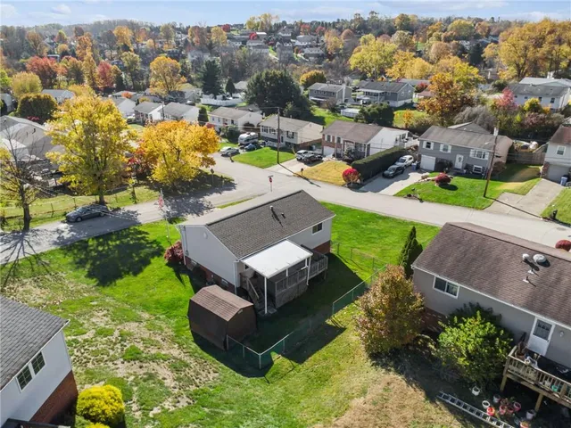 an aerial view of a house with a garden
