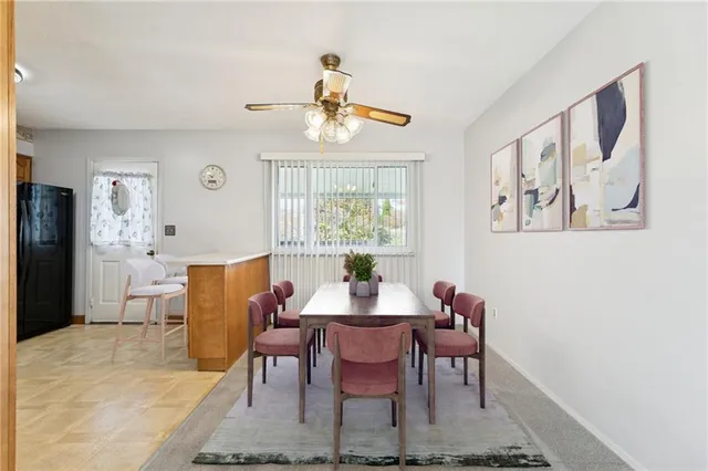a dining room with furniture and window