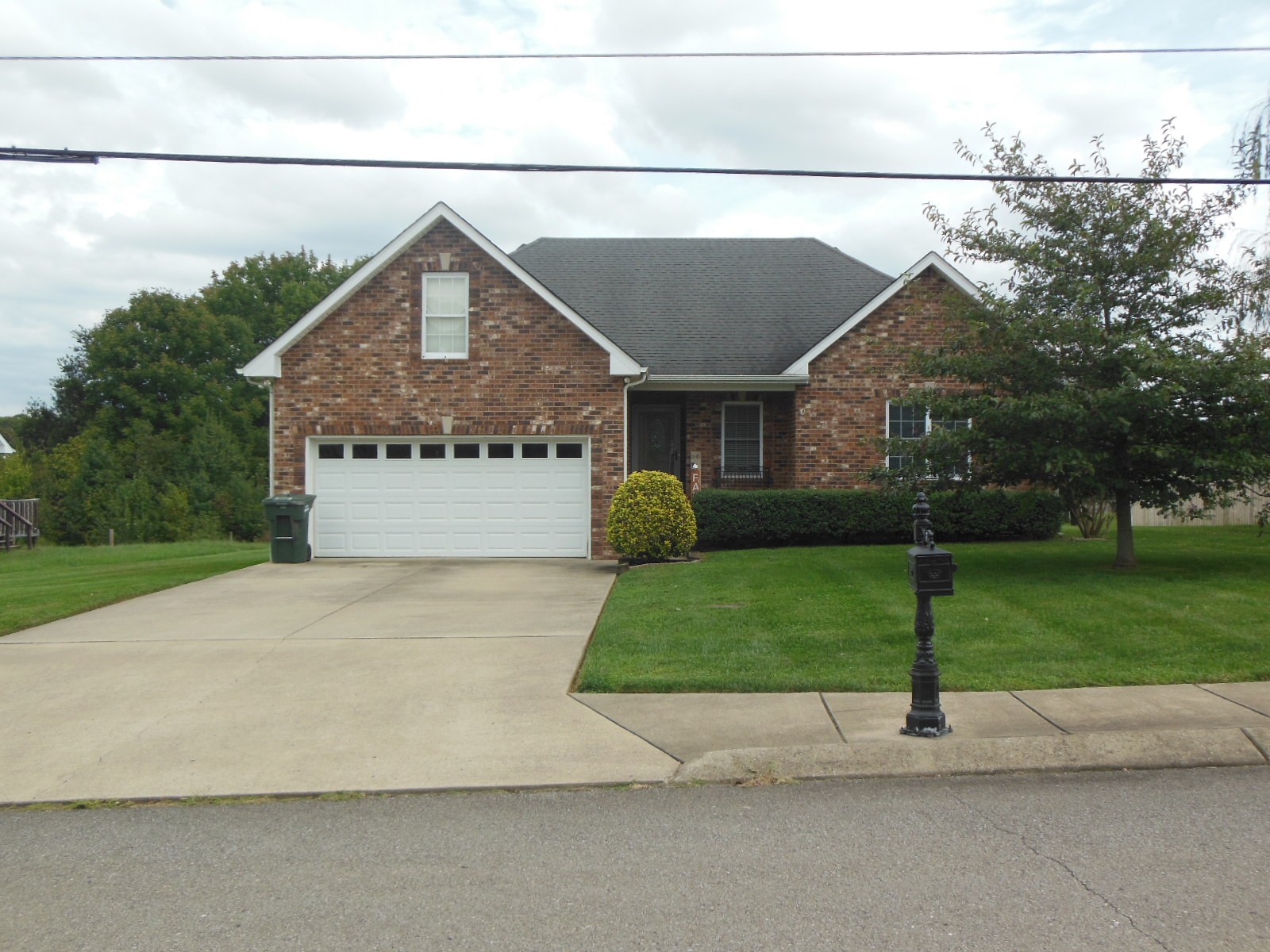 321 Arabian Lane Springfield, TN 37172 - Photo 1 of 23 a front view of a house with a yard and garage