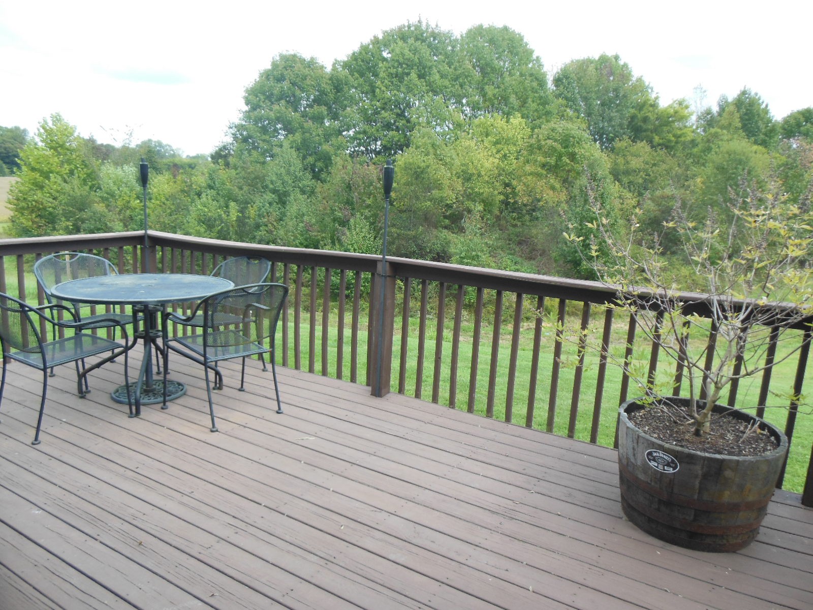 321 Arabian Lane Springfield, TN 37172 - Photo 15 of 23 a balcony with wooden floor table and chairs