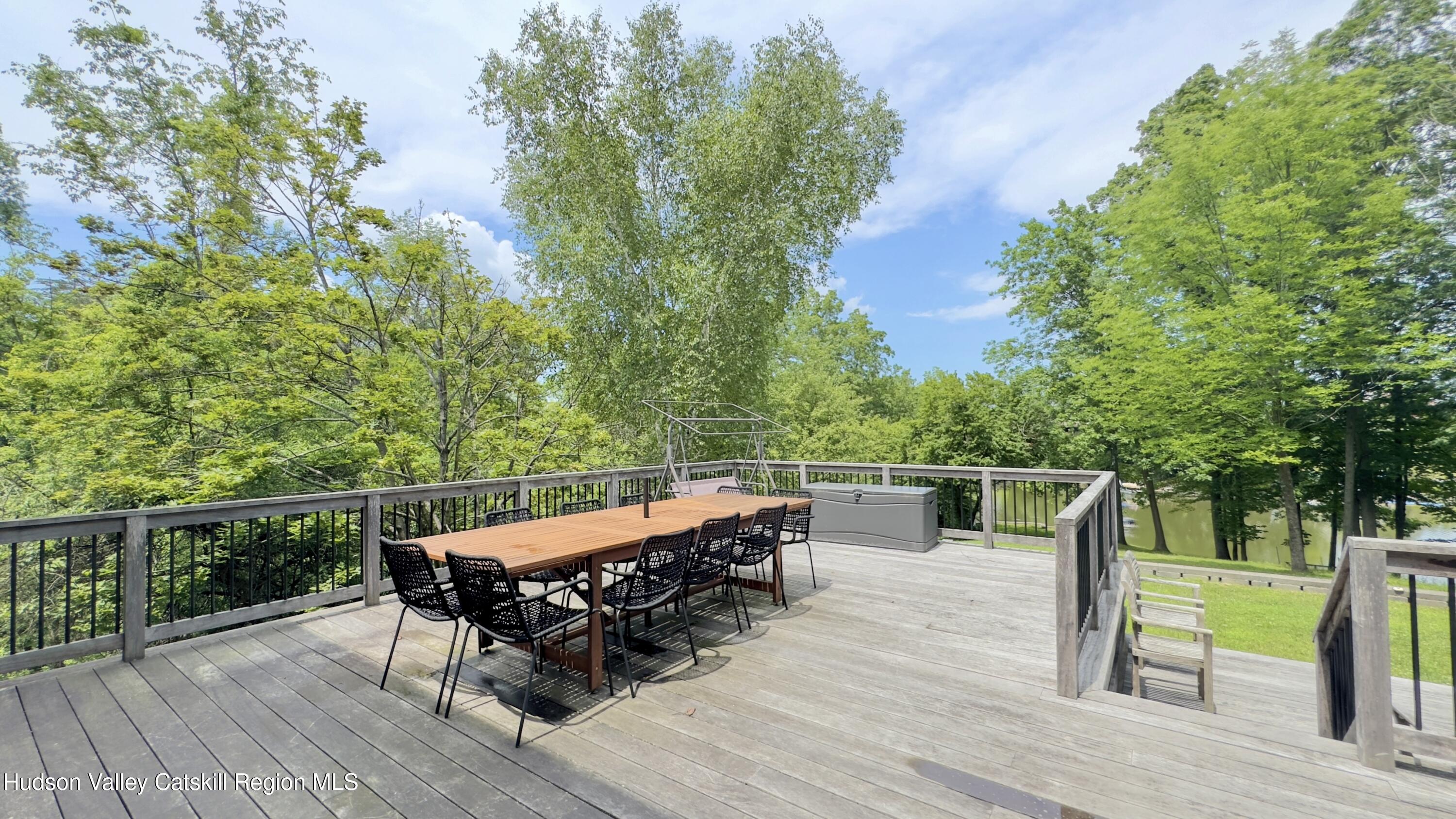3223 Sleepy Hollow Road Athens, NY 12015 - Photo 32 of 55 a view of a roof deck with couches and wooden fence