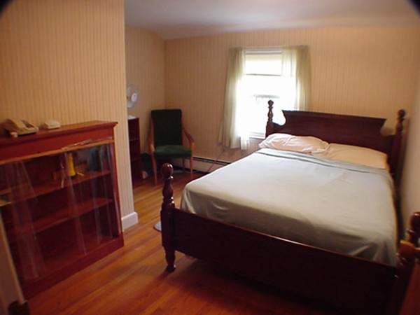 33 Stowecroft Road Arlington, MA 02474 - Photo 12 of 30 a bedroom with a bed and a window