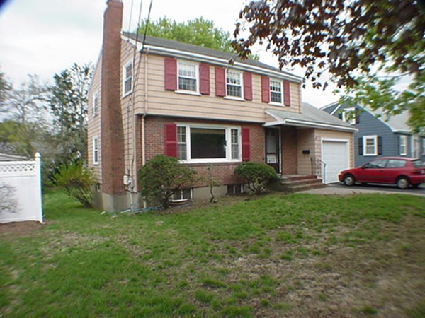33 Stowecroft Road Arlington, MA 02474 - Photo 29 of 30 a front view of a house with a yard and trees