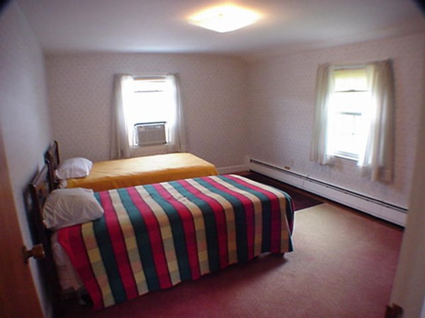 33 Stowecroft Road Arlington, MA 02474 - Photo 10 of 30 a bedroom with a bed and window