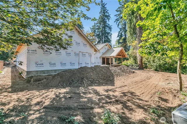 an aerial view of a houses with a lake view