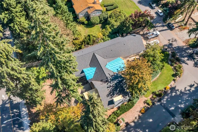 an aerial view of a house with a yard