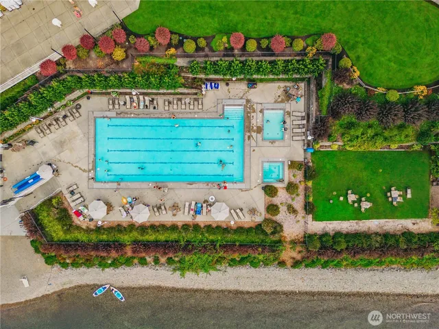 a green field with trees in the background