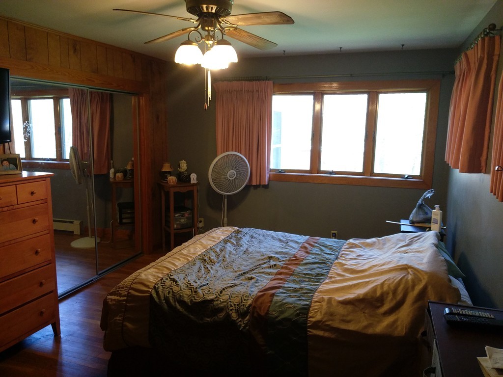 157 State Road Templeton, MA 01436 - Photo 6 of 8 a bed sitting in a bedroom next to a window