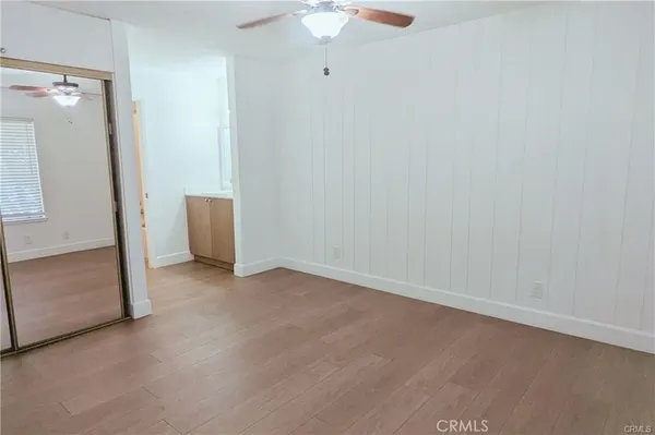 an empty room with a mirror