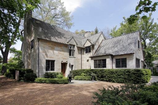 153 Ridge Lane Lake Forest, IL 60045 - Photo 1 of 15 a front view of a house with a garden