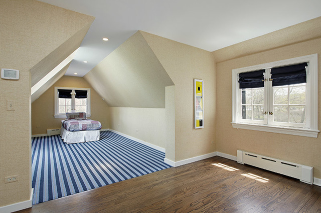 153 Ridge Lane Lake Forest, IL 60045 - Photo 11 of 15 a bedroom with a bed and wooden floor