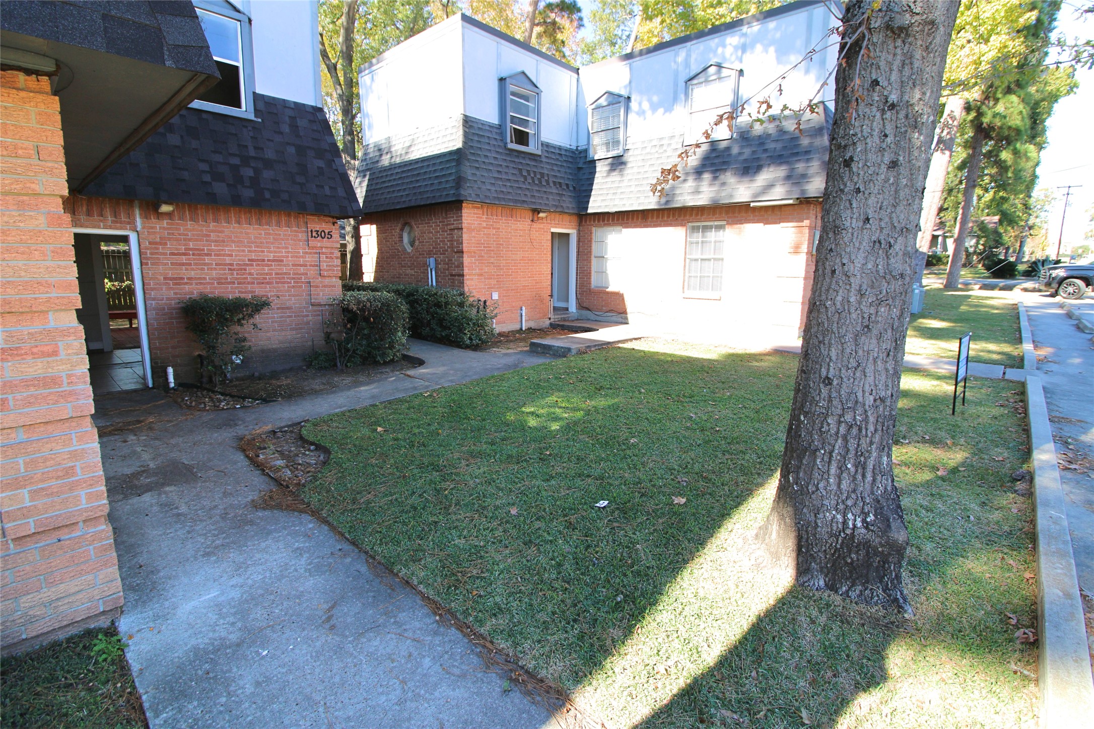 1305 Adams Street, Unit 7 Conroe, TX 77301 - Photo 11 of 12 a view of a backyard with garden