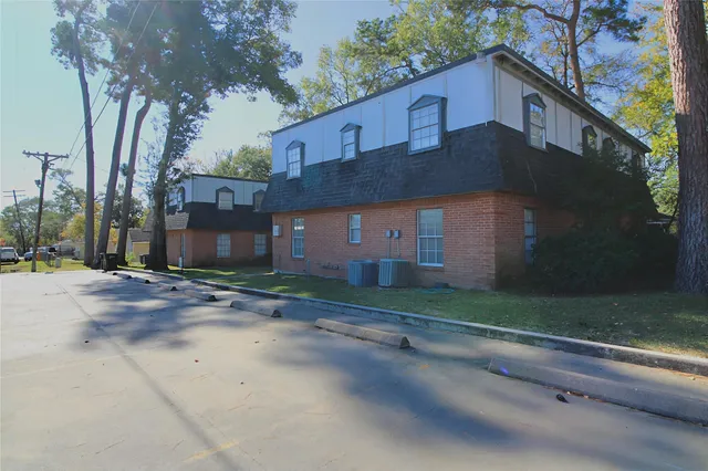 a front view of a house with a yard and a garage